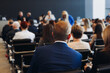 © tsuguliev - Audience at the modern conference hall listens to panel discussion, people on a congress event together listen to speaker on stage at convention, business seminar, large venue for forum presentation
