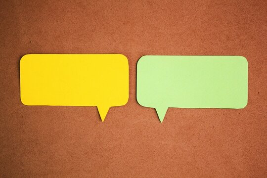two examples of green and yellow conversation columns. Comic speech balloon. paper speech bubble. conversation concept