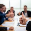 © bao - A group of professionals showing thumbs up, symbolizing teamwork, success, and positivity in a corporate setting.