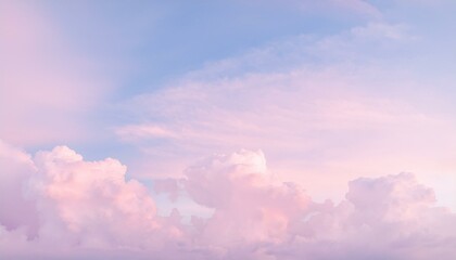 Wall Mural - Soft pink clouds drift across a pastel sky.