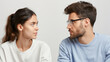 © Vilaysack - close up of two people exchanging meaningful glance, conveying connection and understanding. individuals are facing each other, with neutral background enhancing their expressions