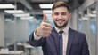 © ittipol - Businessman Giving Thumbs Up: A portrait of a smiling, confident businessman in a sharp suit giving a thumbs up gesture, conveying success, approval, and positive attitude.