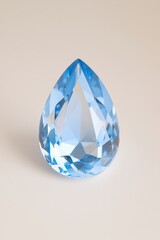Poster - Elegant blue crystal droplet reflecting light, showcasing intricate facets and a dazzling appearance for decorative purposes.
