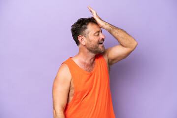 Wall Mural - Middle age caucasian man isolated on purple background has realized something and intending the solution