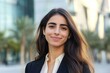 © Ace64 Studio - Closeup headshot outdoor portrait of young middle eastern Israel businesswoman standing office building.