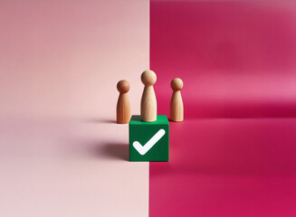 Leinwandbilder - Grainy texture image of three wooden figurines surrounding a green cube with a checkmark.  The scene is split by a pink and crimson backdrop.