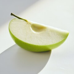 Poster - Fresh green apple slice showcasing crisp texture and juicy interior on a clean surface