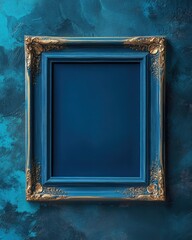 Ornate blue and gold empty picture frame on textured wall