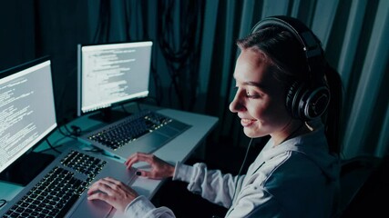 Poster - Intense coding session in a dimly lit workspace with dual computer screens