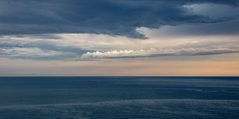 a large thundercloud over the horizon of the black sea