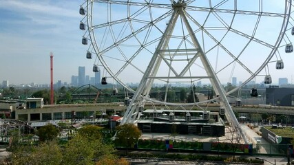 Wall Mural - Drone footage of the Ferris wheel on the shore of Mayor Lake in Bosque de Chapultepec Park, Mexico