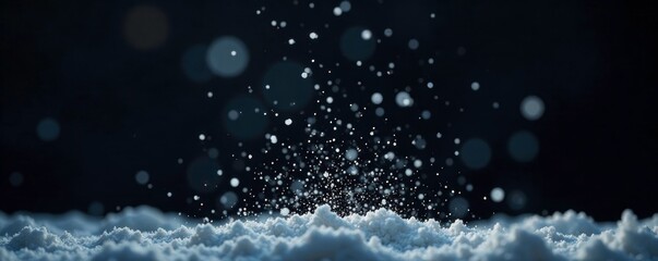 Wall Mural - Gentle snowfall with powdery particles in the air on a black background, falling, blur