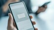 © เด็กชาย นุ่มนิ่ม - spam call phone security concept. A person holding a smartphone with a blank screen, while another phone is visible in the background.