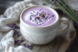 A creamy lavender honey latte with soft purple hues and a touch of dried lavender.