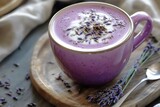 A creamy lavender honey latte with soft purple hues and a touch of dried lavender.