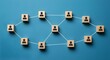 © DigiwaveCreators - Wooden blocks with user icons, connected by white lines, social network concept, organizational structure, blue background.