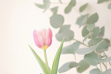 Poster - A single pink tulip sits in a vase surrounded by lush green leaves, perfect for adding a pop of color to any space