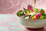 Tahini Sauce Drizzled Over Fresh Vegetable Salad in Vibrant Healthy Meal