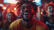 © DSimage - A joyful man with dreadlocks and glasses enjoys the vibrant atmosphere of a bustling nightclub filled with people.