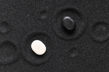 Wall Mural - Stones on black sand with circles. Yin Yang concept