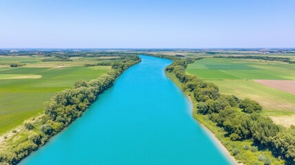 Wall Mural - Aerial view of serene river flowing through lush agricultural landscape