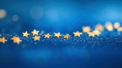 Wall Mural - tiny gold stars forming a delicate wave on a vibrant blue bokeh gradient.