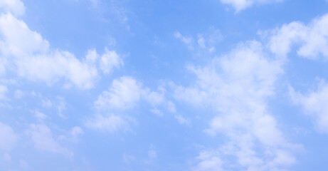 Wall Mural - clean air daytime bright blue sky and clouds.view of blue sky with shining sun. white fluffy clouds 