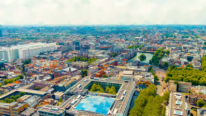 Wall Mural - The Hague, Netherlands. Watercolor illustration. Binnenhof. Hofvijver lake in the historical city center. Cloudy weather. Summer day, Aerial View