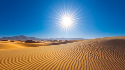 a desert landscape in the summer golden sand dunes under a bright sun with clear blue sky
