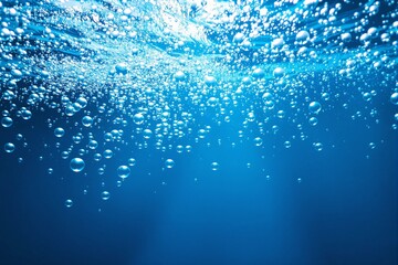 Poster - Abstract underwater view with air bubbles in blue light background.
