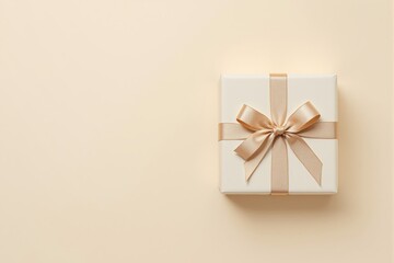 Aufkleber - Elegant gift box with golden ribbon placed on beige background.