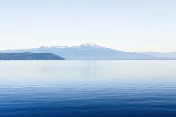 mountain lake gradient: a mountain lake with water transitioning from clear near the shore to deep b