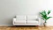 © New stock - A modern white sofa with wooden legs sits against a blank wall, accompanied by a lush green plant in a ceramic pot, creating a serene living space.