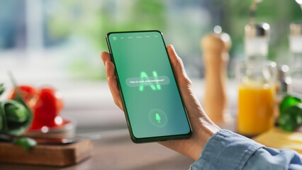 Fototapete - Hand Holds a Smartphone Displaying an AI Chatbot Interface. Device Shows Recipe Ingredients and Instructions, Ai Assistant Provides Culinary Guidance. Technology Helps  Mobile Phone User