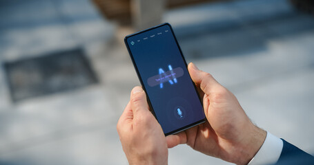 Fototapete - POV Shot: Business Person Holds Smartphone Screen Shows AI Chatbot Interface in Use. Display Productivity Tips and Management Advice, AI Assistant for Personal Efficiency and Organization in eBusiness