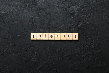 INTERNET word written on wood block. INTERNET text on cement table for your desing, concept