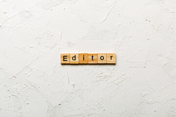 Wall Mural - editor word written on wood block. editor text on table, concept