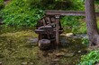 © Olha - Wooden mill on a lake in a mountain alpine forest. Scenery.
