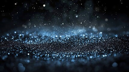 Poster - Close-up of sparkling blue particles on a dark background creating a magical atmosphere for festive celebrations
