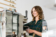 © Westend61 - Proud young woman working in her own coffee shop