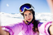 © Westend61 - Selfie of young woman in ski clothes in snow covered-landscape
