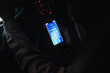 © Westend61 - Close-up of young man connecting smartphone with wifi in car at night