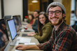 © N. W. - photo of a team of young business men women working in teamwork on their computer in an office smiling into the camera