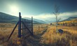 © IndrawanDex - Rustic wooden gate on a path through autumn meadow in mountain valley at sunrise