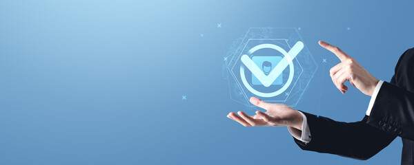 Fototapete - Businessman presenting virtual check mark icon on holographic interface.