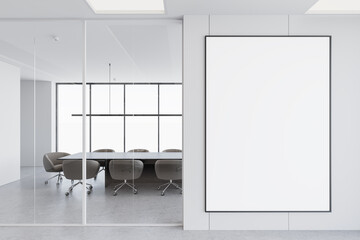 Wall Mural - Modern office interior with empty framed mockup poster on the wall and conference room with glass partition. 3D Rendering