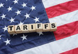 © Andrii - Import Trade Tariffs increase concept with United States of America Flag. Trade wars