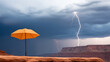 © kampolsuk - dramatic lightning storm illuminates Grand Canyon, with orange umbrella standing out against dark clouds. scene captures power of nature and contrast of colors