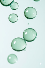 Poster - A minimalistic macro shot of green transparent spheres floating in mid-air over a clean white surfac