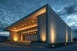 © Designs to Display - A modern cinema building with clean lines, soft lighting, and a textured concrete exterior